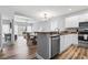 Open-concept kitchen featuring modern stainless steel appliances and laminate flooring at 1017 World Tour Blvd. # 206, Myrtle Beach, SC 29579