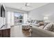 Comfortable living room with neutral tones, balcony access, and stylish nautical patterned accents at 1017 World Tour Blvd. # 206, Myrtle Beach, SC 29579