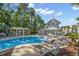 An outdoor pool with lounge chairs and a charming pool house at 1017 World Tour Blvd. # 206, Myrtle Beach, SC 29579