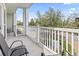 Outdoor porch with seating that overlooks a view of neighborhood streets and mature trees at 1017 World Tour Blvd. # 206, Myrtle Beach, SC 29579
