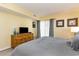 Comfortable bedroom featuring a dresser and access to a private balcony at 105 S Ocean Blvd. # 108, North Myrtle Beach, SC 29582