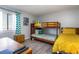 Bedroom featuring a bunk bed, twin bed, and natural light at 105 S Ocean Blvd. # 108, North Myrtle Beach, SC 29582