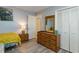 Bedroom featuring a single bed, dresser, closet space, and natural light at 105 S Ocean Blvd. # 108, North Myrtle Beach, SC 29582