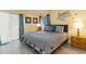 Bright bedroom features a comfortable bed, coastal decor, and natural light at 105 S Ocean Blvd. # 108, North Myrtle Beach, SC 29582