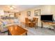 Comfortable living room area with a dining table and views into the open kitchen at 105 S Ocean Blvd. # 108, North Myrtle Beach, SC 29582