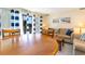 Living room with sliding glass doors, a dining table, and comfortable furnishings at 105 S Ocean Blvd. # 108, North Myrtle Beach, SC 29582