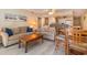 Comfortable living room with modern flooring, casual seating, dining area and an open kitchen at 105 S Ocean Blvd. # 108, North Myrtle Beach, SC 29582