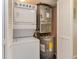 Laundry/utility closet containing an HVAC system, water heater, and a washer/dryer unit at 105 S Ocean Blvd. # 108, North Myrtle Beach, SC 29582