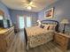 Bedroom features french doors to private balcony, ample storage space, and marine themed decor at 1058 Sea Mountain Hwy. # 14-203, North Myrtle Beach, SC 29582