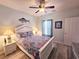Inviting bedroom features a decorative fish, ceiling fan, and comfortable bed at 1058 Sea Mountain Hwy. # 14-203, North Myrtle Beach, SC 29582