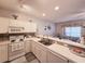 Bright kitchen with sleek countertops, white appliances, and an open view to the living area at 1058 Sea Mountain Hwy. # 14-203, North Myrtle Beach, SC 29582