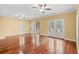 Bright living room featuring hardwood floors, ceiling fans, and access to the outdoor deck at 1335 Hidden Harbor Rd., Myrtle Beach, SC 29577