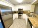 Modern kitchen with stainless steel appliances and granite countertops at 1401 S Ocean Blvd. S # 1003, North Myrtle Beach, SC 29582