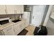Compact kitchen featuring white cabinets, updated countertops, and essential appliances for convenient meal preparation at 1600 Ocean Blvd. S # 226, Myrtle Beach, SC 29577