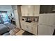 The kitchenette features white cabinets and a refrigerator at 1600 Ocean Blvd. S # 226, Myrtle Beach, SC 29577