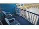Hotel room balcony with two chairs with cushions and a view to the pool and grassy area at 1600 S Ocean Blvd. # 326, Myrtle Beach, SC 29577