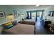 Bright living space with two beds and a sliding glass door to the balcony at 1600 S Ocean Blvd. # 326, Myrtle Beach, SC 29577