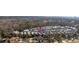 Aerial view of community with lush trees, blue skies, and view of home at 1604 Cottage Cove Circle, North Myrtle Beach, SC 29582