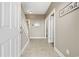 Inviting entryway with neutral walls, tile flooring, a 'welcome' sign, and staircase leading to the upper level at 1604 Cottage Cove Circle, North Myrtle Beach, SC 29582