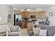 Modern kitchen with stainless steel appliances, breakfast bar, and adjacent living area at 1604 Cottage Cove Circle, North Myrtle Beach, SC 29582