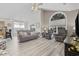 Spacious living room with vaulted ceiling, open to the kitchen, with plenty of seating at 1604 Cottage Cove Circle, North Myrtle Beach, SC 29582