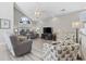 Bright living room with vaulted ceilings, large windows, and comfortable seating at 1604 Cottage Cove Circle, North Myrtle Beach, SC 29582