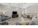 Comfortable living room showcasing the vaulted ceiling, wooden floors, and cozy furniture at 1604 Cottage Cove Circle, North Myrtle Beach, SC 29582