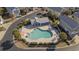 Community pool with inviting lounge area, manicured landscape, and shaded pool house at 1604 Cottage Cove Circle, North Myrtle Beach, SC 29582