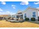 Charming home with a spacious backyard featuring a brick patio and screened porch at 1606 Lake Egret Dr., North Myrtle Beach, SC 29582