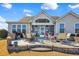 Outdoor patio with brick surround, summer kitchen, and screened porch offer outdoor living at 1606 Lake Egret Dr., North Myrtle Beach, SC 29582
