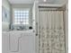 Clean bathroom featuring a walk-in tub and a shower with decorative curtains at 1606 Lake Egret Dr., North Myrtle Beach, SC 29582