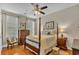 This bedroom features a four poster bed, hardwood floors, and a ceiling fan at 1606 Lake Egret Dr., North Myrtle Beach, SC 29582