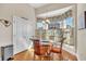 Bright breakfast nook features a glass table and a large bay window at 1606 Lake Egret Dr., North Myrtle Beach, SC 29582