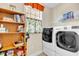 The laundry room features a window with valence and a large capacity washer and dryer at 1606 Lake Egret Dr., North Myrtle Beach, SC 29582
