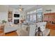 Comfortable living room with a fireplace, TV, plush seating, and large windows letting in natural light at 1606 Lake Egret Dr., North Myrtle Beach, SC 29582