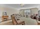 This living room features carpet, a ceiling light, and neutral colored reclining furniture at 1606 Lake Egret Dr., North Myrtle Beach, SC 29582