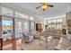 Spacious living room with hardwood floors, comfortable seating, and large windows offering a view of the lake at 1606 Lake Egret Dr., North Myrtle Beach, SC 29582