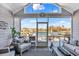 This screened-in porch features ample seating, a fan, and views of the lake at 1606 Lake Egret Dr., North Myrtle Beach, SC 29582