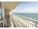Oceanfront balcony featuring seating with a stunning view of the beach and the ocean at 1625 S Ocean Blvd. # 1109, North Myrtle Beach, SC 29582