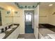 Relax in the spacious bathroom with a tub and double vanity at 1625 S Ocean Blvd. # 1109, North Myrtle Beach, SC 29582
