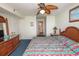 Cozy bedroom featuring a striking ceiling fan, comfortable bed and doorway to the attached bathroom at 1625 S Ocean Blvd. # 1109, North Myrtle Beach, SC 29582