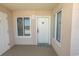 Condo entrance door featuring a window, lockbox and welcome mat at 1625 S Ocean Blvd. # 1109, North Myrtle Beach, SC 29582