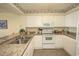 Bright kitchen showcasing granite countertops, a stainless steel sink, and modern appliances in a well-lit space at 1625 S Ocean Blvd. # 1109, North Myrtle Beach, SC 29582