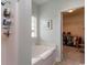 Clean bathroom with a tub, shower, and access to a walk-in closet for added convenience at 206 Marley Ct., Conway, SC 29526