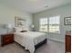 Cozy bedroom with a plush bed, soft lighting, and a serene ambiance for relaxation at 206 Marley Ct., Conway, SC 29526