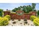 Stone sign for Harmon's Crossing community, surrounded by greenery and landscaping at 206 Marley Ct., Conway, SC 29526