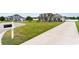 Beautiful home with a well-maintained lawn, long concrete driveway, and inviting curb appeal at 206 Marley Ct., Conway, SC 29526