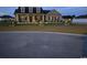 Charming single-Gathering home with a landscaped front yard and inviting entrance illuminated at dusk at 206 Marley Ct., Conway, SC 29526