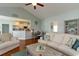 Comfortable living room featuring vaulted ceilings and an open layout into the kitchen at 206 Marley Ct., Conway, SC 29526