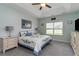 Beautiful main bedroom with tray ceiling, a ceiling fan, coordinated decor, and comfortable carpeting at 206 Marley Ct., Conway, SC 29526